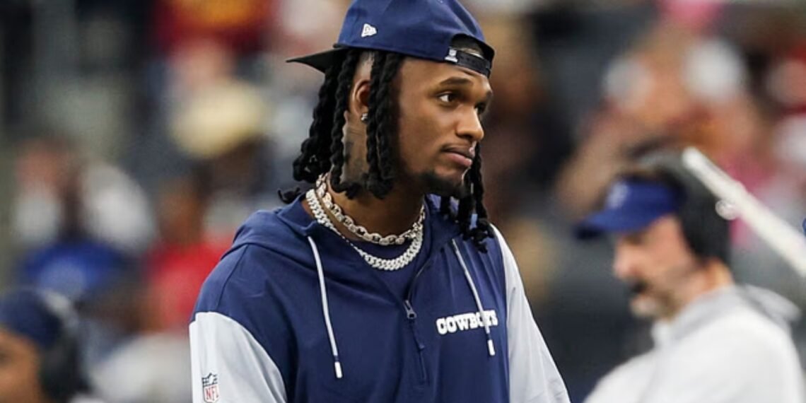 Dallas Cowboys wide receiver CeeDee Lamb watches from the sidelines during the first half against the Washington Commanders at AT&T Stadium.