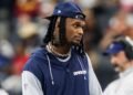 Dallas Cowboys wide receiver CeeDee Lamb watches from the sidelines during the first half against the Washington Commanders at AT&T Stadium.