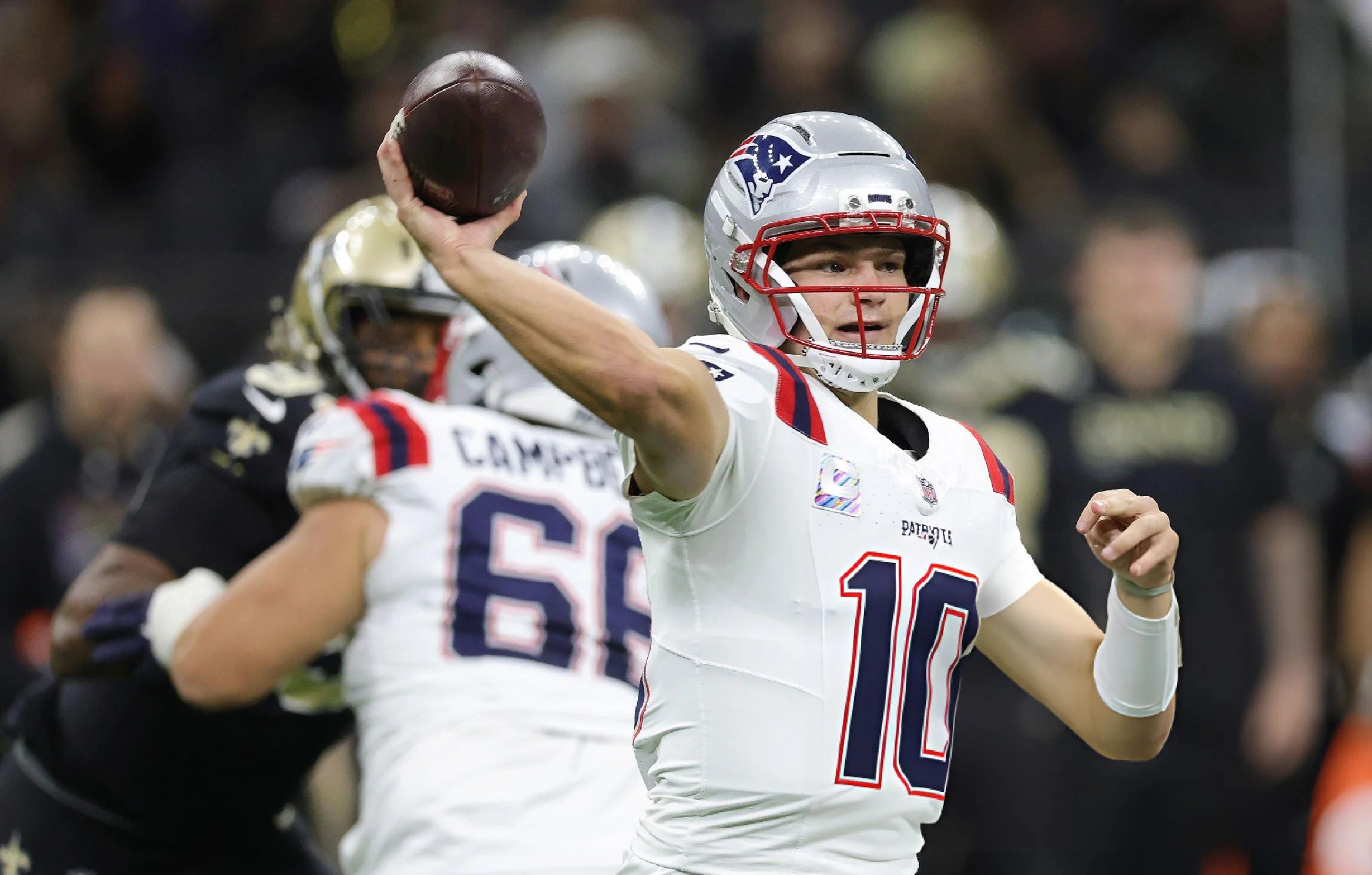 Drake Maye #10 of the New England Patriots looks to pass during a game against the New Orleans Saints at the Caesars Superdome on October 12, 2025 in New Orleans, Louisiana.