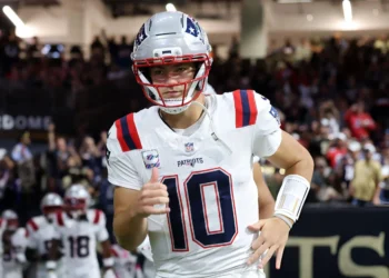 Drake Maye #10 of the New England Patriots takes on the field prior to the game against the New Orleans Saints at Caesars Superdome on October 12, 2025 in New Orleans, Louisiana.