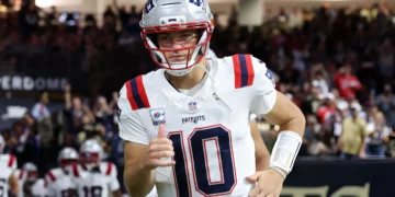 Drake Maye #10 of the New England Patriots takes on the field prior to the game against the New Orleans Saints at Caesars Superdome on October 12, 2025 in New Orleans, Louisiana.