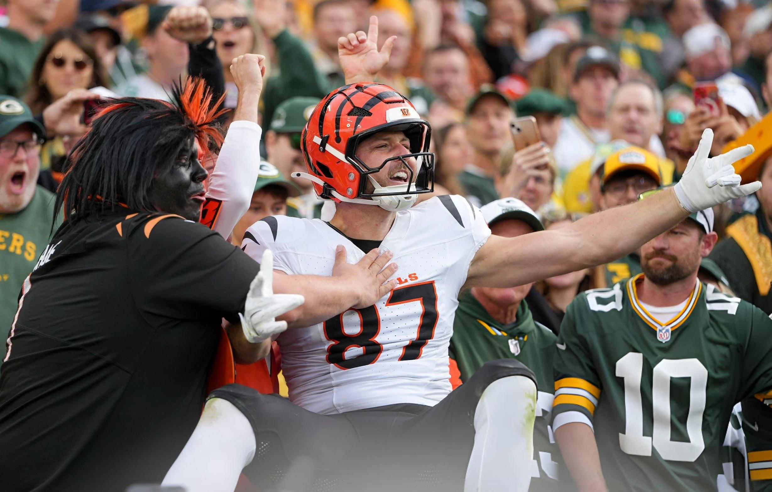 Tanner Hudson #87 of the Cincinnati Bengals celebrates scoring a touchdown during the second half of an NFL football game against the Green Bay Packers at Lambeau Field in Green Bay, Wisconsin.