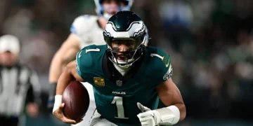 Jalen Hurts #1 of the Philadelphia Eagles runs with the ball during the second quarter against the Detroit Lions at Lincoln Financial Field on November 16, 2025 in Philadelphia, Pennsylvania.