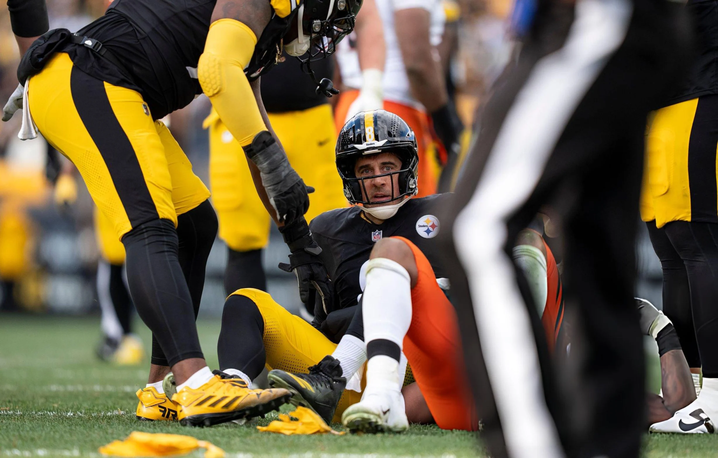 Aaron Rodgers #8 of the Pittsburgh Steelers reacts after being sacked during an NFL football game against the Cincinnati Bengals at Acrisure Stadium on November 16, 2025 in Pittsburgh, Pennsylvania.