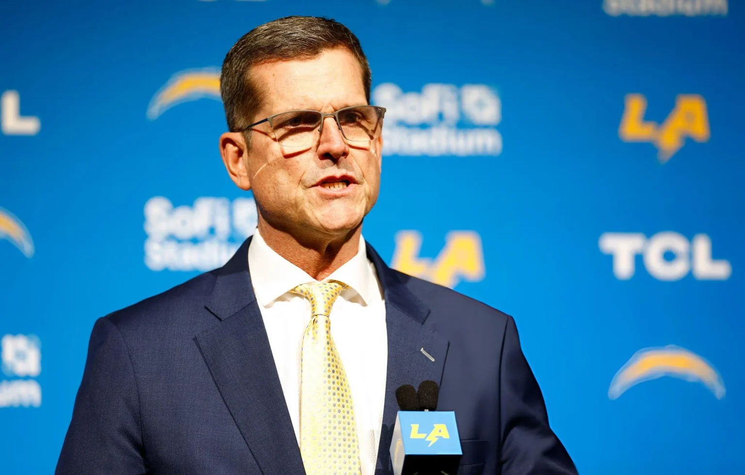 Newly appointed head coach Jim Harbaugh of the Los Angeles Chargers speaks to the media during a press conference at YouTube Theater in Inglewood, California.