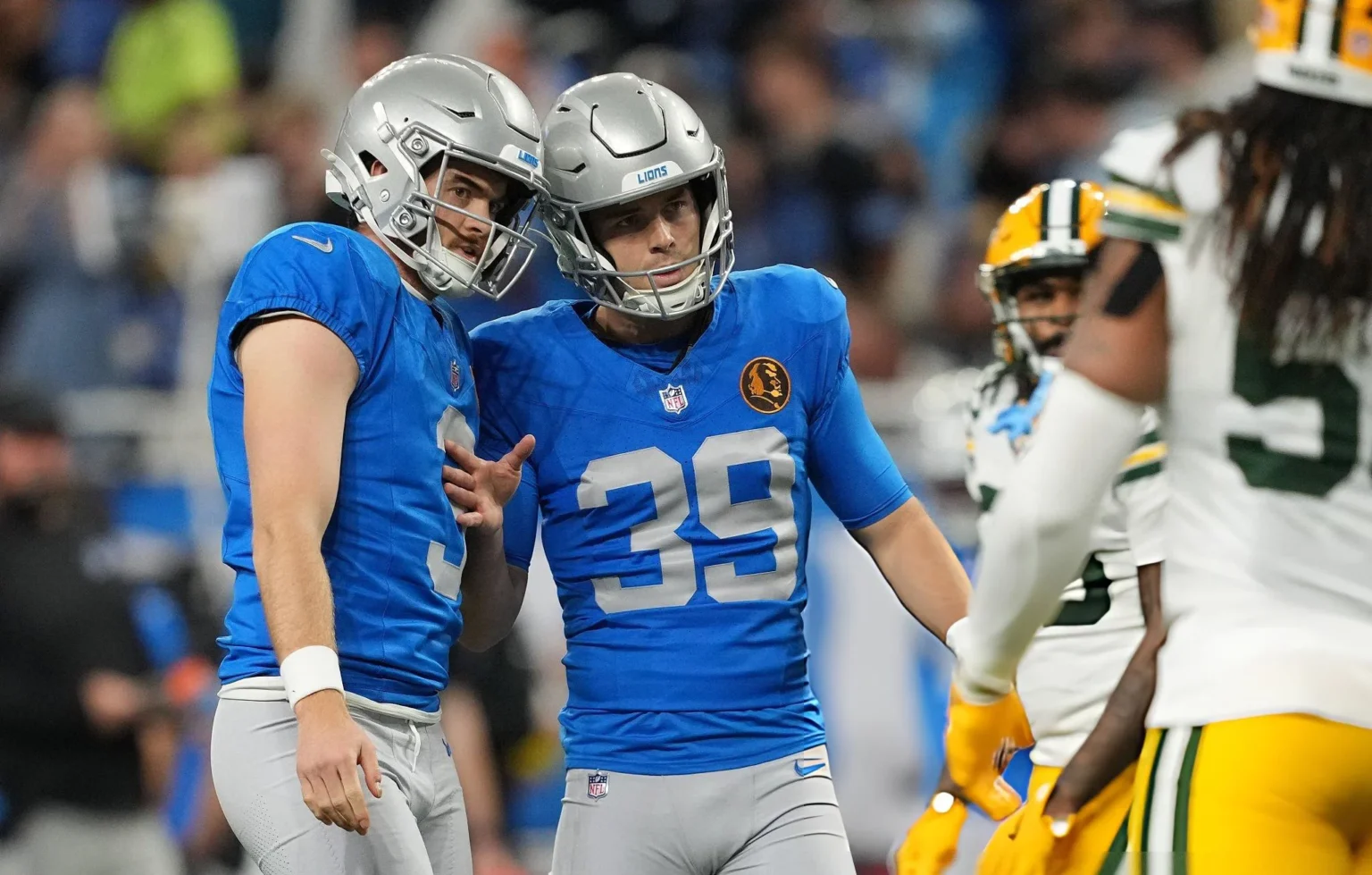 “BS Call”: Lions Fans Reacts as Packers Benefit From Questionable Timeout Call Jack Fox #3 and Jake Bates #39 of the Detroit Lions react after a extra point during the second quarter against the Green Bay Packers at Ford Field on November 27, 2025 in Detroit, Michigan. (Photo by Nic Antaya/Getty Images)
