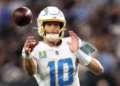 Justin Herbert #10 of the Los Angeles Chargers throws a pass against the Las Vegas Raiders during the first quarter at Allegiant Stadium in Las Vegas, Nevada. (Photo by Sean M. Haffey/Getty Images)