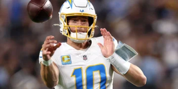 Justin Herbert #10 of the Los Angeles Chargers throws a pass against the Las Vegas Raiders during the first quarter at Allegiant Stadium in Las Vegas, Nevada. (Photo by Sean M. Haffey/Getty Images)
