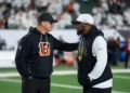 Head coach Zac Taylor of the Cincinnati Bengals and head coach Mike Tomlin of the Pittsburgh Steelers chat prior to an NFL football game at Paycor Stadium in Cincinnati, Ohio.