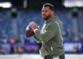 Russell Wilson #3 of the New York Giants warms up wearing Salute to Service gear prior to an NFL football game against the Green Bay Packers at MetLife Stadium on November 16, 2025 in East Rutherford, New Jersey. (Photo by Kevin Sabitus/Getty Images)