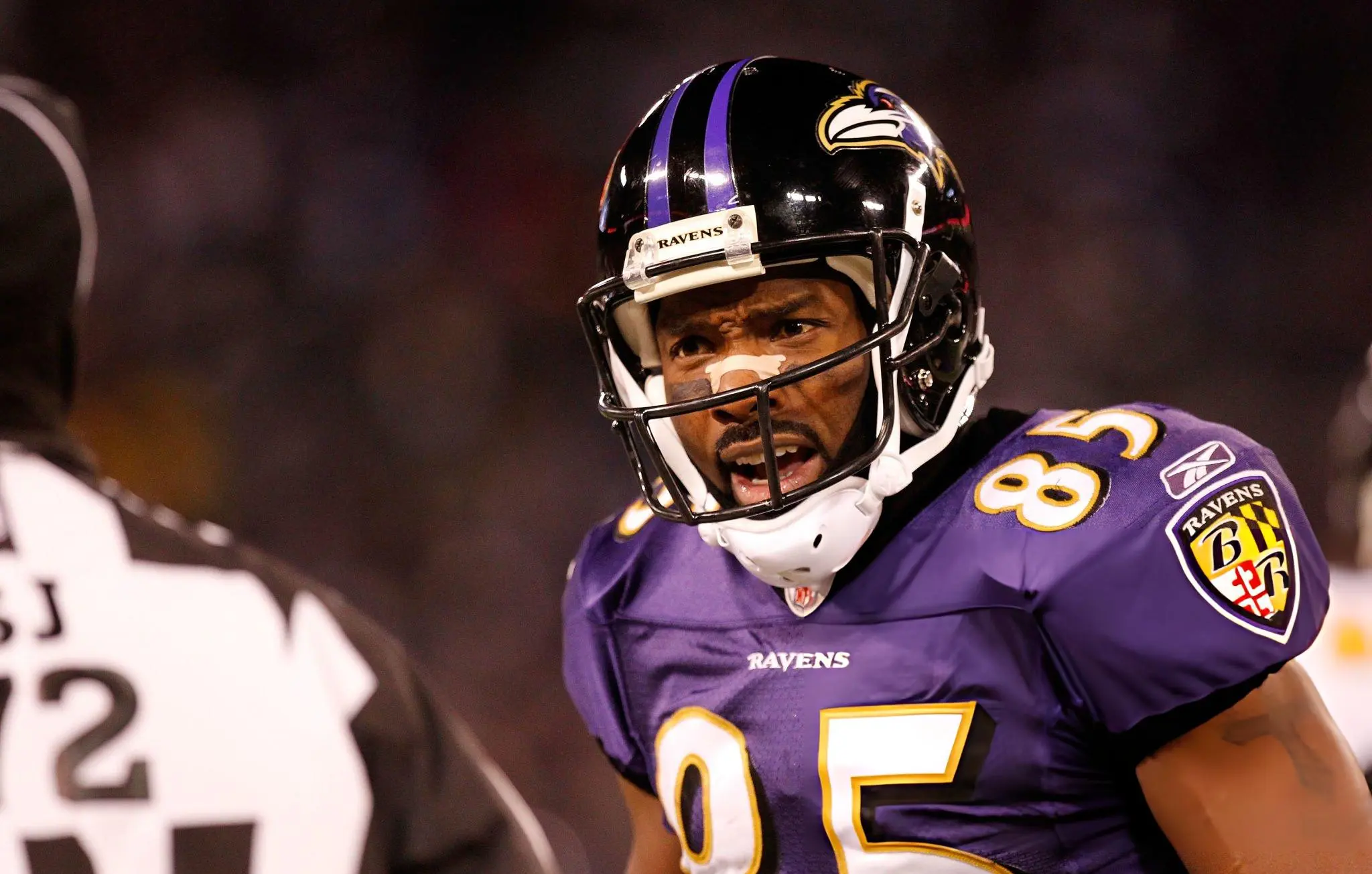 Derrick Mason #85 of the Baltimore Ravens argues a call with a referee during the game against the Pittsburgh Steelers at M&T Bank Stadium on December 5, 2010 in Baltimore, Maryland. Pittsburgh won 13-10.