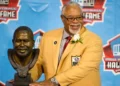 Former defender Curley Culp poses with his bust during the NFL Class of 2013 Enshrinement Ceremony at Fawcett Stadium on Aug. 3, 2013 in Canton, Ohio. (Photo by Jason Miller/Getty Images)