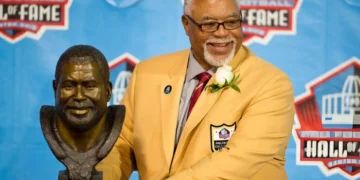 Former defender Curley Culp poses with his bust during the NFL Class of 2013 Enshrinement Ceremony at Fawcett Stadium on Aug. 3, 2013 in Canton, Ohio. (Photo by Jason Miller/Getty Images)