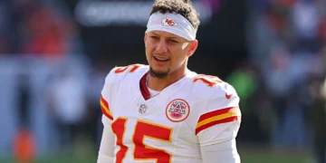 Patrick Mahomes #15 of the Kansas City Chiefs looks on during warmups before the game against the Denver Broncos at Empower Field At Mile High on November 16, 2025 in Denver, Colorado. (Photo by Jamie Schwaberow/Getty Images)