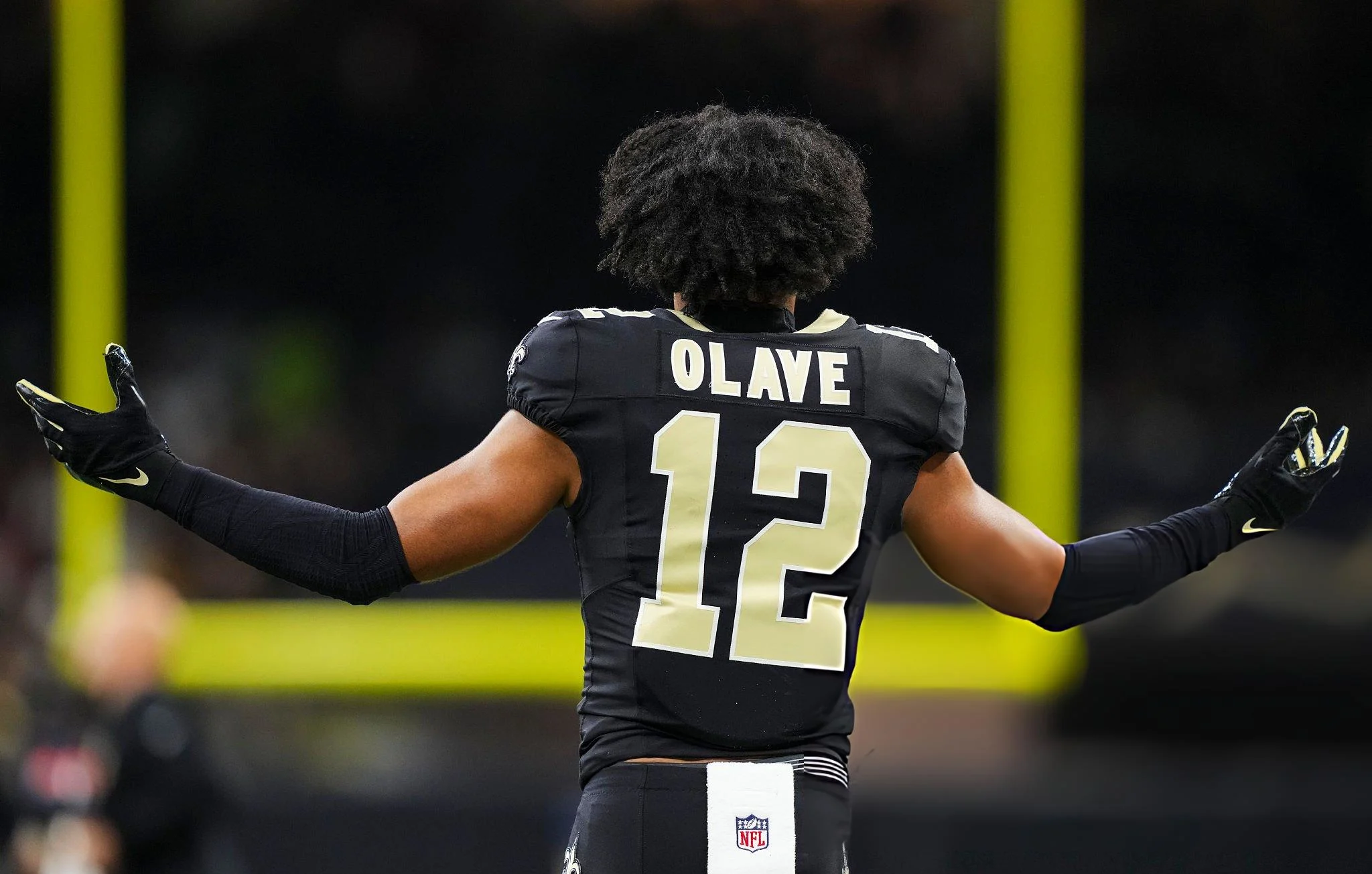 Chris Olave #12 of the New Orleans Saints looks on from the field during an NFL football game against the Atlanta Falcons at Caesars Superdome on November 23, 2025 in New Orleans, Louisiana. (Photo by Perry Knotts/Getty Images)
