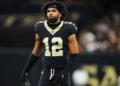 Chris Olave #12 of the New Orleans Saints looks on from the field during an NFL football game against the Atlanta Falcons at Caesars Superdome on November 23, 2025 in New Orleans, Louisiana. (Photo by Perry Knotts/Getty Images)