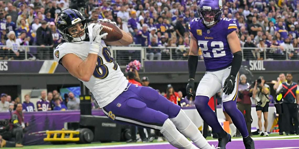 Baltimore Ravens tight end Mark Andrews (89) catches a 2-yard pass for a touchdown as Minnesota Vikings defensive back Harrison Smith (22) looks on during the fourth quarter of a NFL game between the Minnesota Vikings and Baltimore Ravens on November 9, 2025, at U.S. Bank Stadium in Minneapolis, MN.