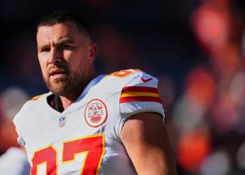 Travis Kelce #87 of the Kansas City Chiefs warms up before kickoff against the Denver Broncos during the second half of an NFL football game at Empower Field at Mile High on November 16, 2025 in Denver, Colorado.