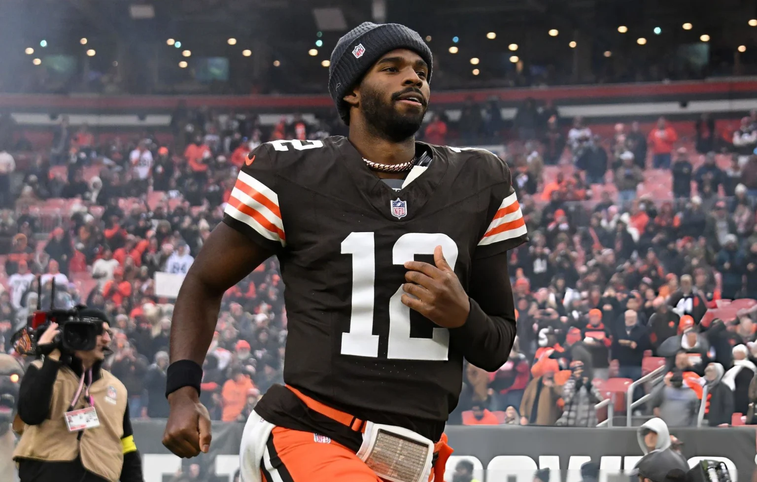 Quarterback Shedeur Sanders #12 of the Cleveland Browns runs onto the field before the NFL 2025 game against the Baltimore Ravens at Huntington Bank Field on November 16, 2025, in Cleveland, Ohio. The Ravens defeated the Browns 23-16. (Photo by Jason Miller/Getty Images)