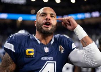 Dak Prescott #4 of the Dallas Cowboys reacts as he leads a huddle prior to an NFL football game against the Detroit Lions at Ford Field