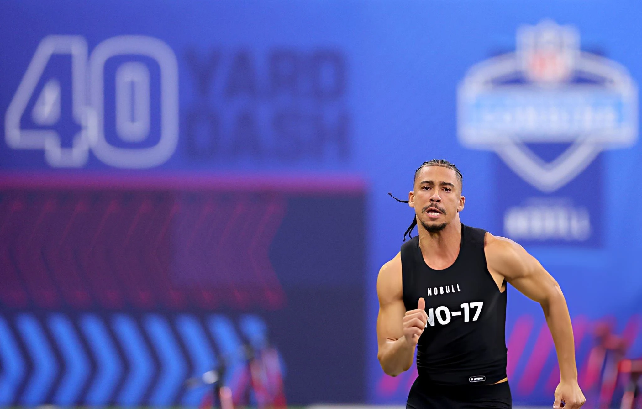 Jalen McMillan #WO17 of Washington participates in the 40-yard dash during the NFL Combine at Lucas Oil Stadium