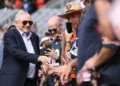 Owner Jerry Jones of the Dallas Cowboys shakes hand with fans before the game against the Chicago Bears at Soldier Field on September 21, 2025 in Chicago, Illinois.