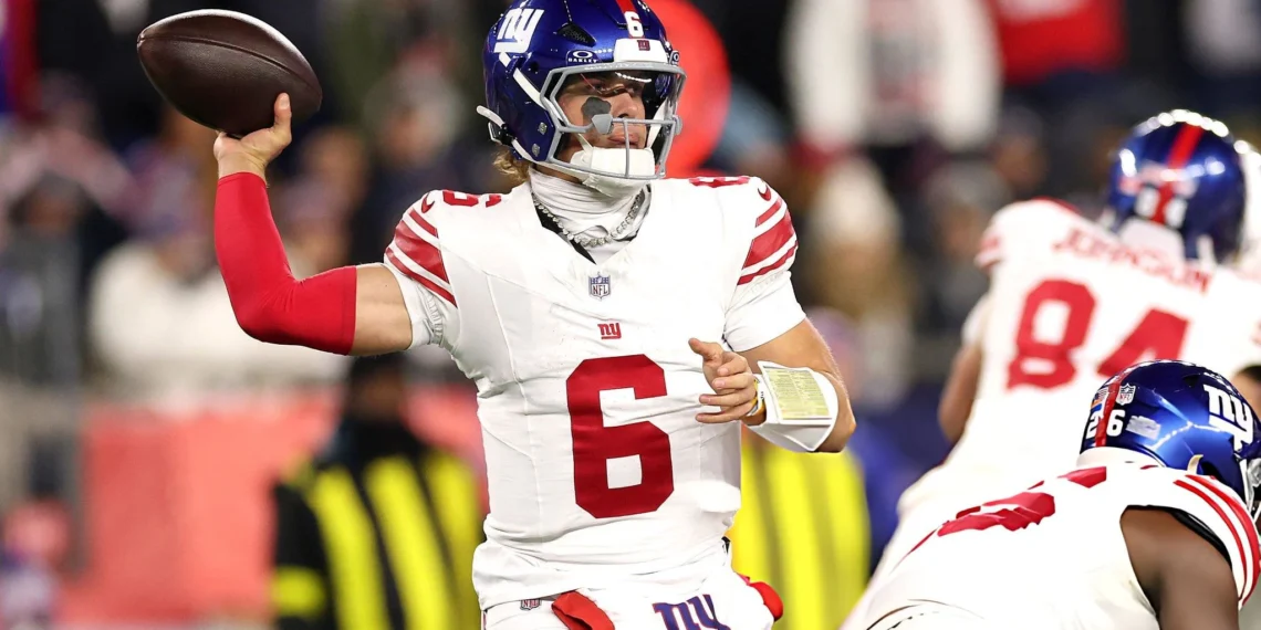 Jaxson Dart #6 of the New York Giants makes a pass during the second quarter of the game against the New England Patriots at Gillette Stadium on December 01, 2025