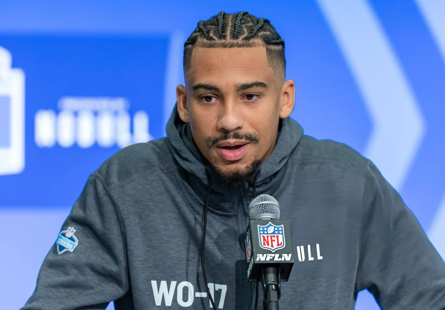 Jalen McMillan #WO17 of the Washington Huskies speaks to the media during the 2024 NFL Draft Combine at Lucas Oil Stadium